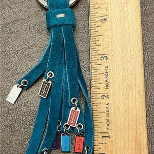 COACH GREEN (TURQUOISE) SUEDE TASSEL KEYCHAIN OR CAN USED AS PURSE CHARM.